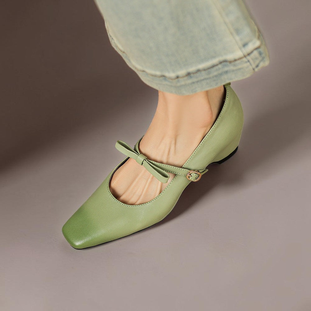 Vivian &amp; Cole Bryony green leather Mary Jane pump with a bow-strap and concealed block heel worn with denim jeans