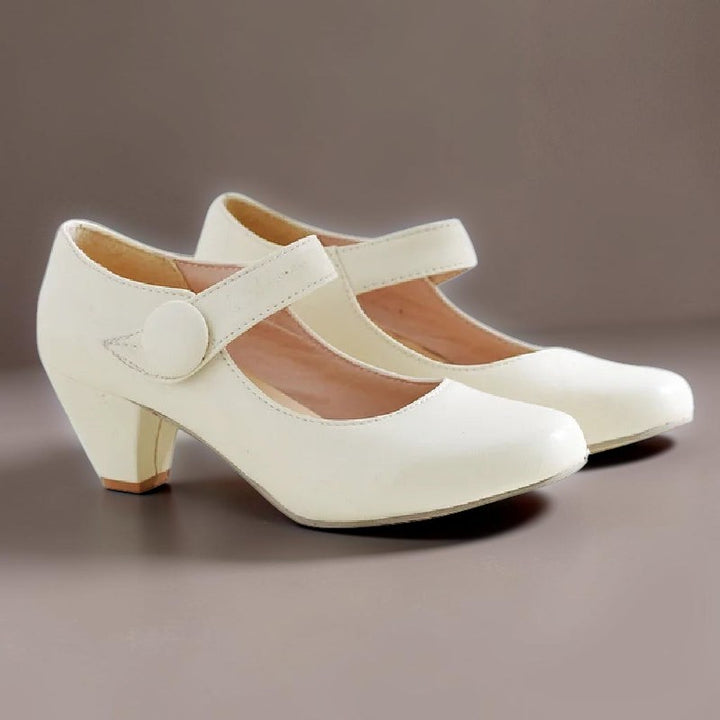 Vivian &amp; Cole Clementine beige block heel Mary Jane shoes with an adjustable instep strap and rounded toe.