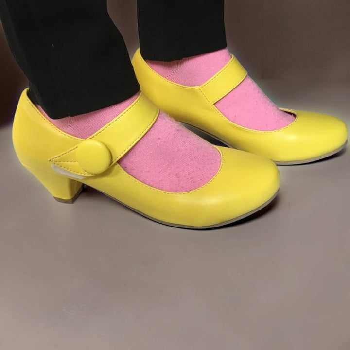 Vivian &amp; Cole Clementine yellow block heel Mary Jane shoes with an adjustable instep strap and rounded toe box.