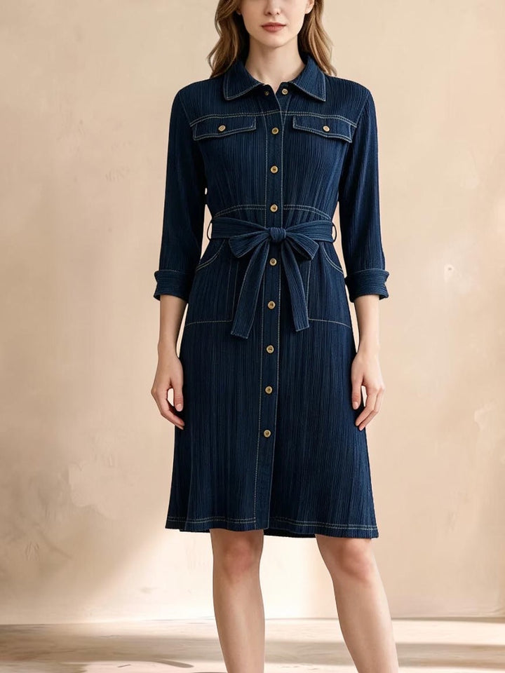 Vivian &amp; Cole Delphine deep blue denim-look midi dress with a button-down front, collar, and waist-tie belt.
