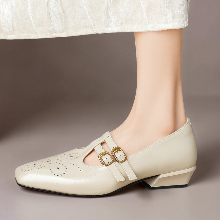 Vivian &amp; Cole Marisol beige leather Mary Jane pump with brogue detailing, dual buckled straps, and a low block heel.