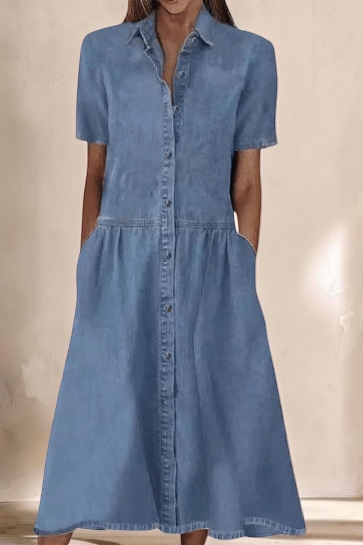 Vivian & Cole Aada denim midi dress with short sleeves, button-down front, and side pockets in light blue wash.