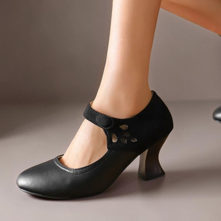 Vivian &amp; Cole Antonia black suede round-toe heels with a stable flared heel and secure ankle strap on a model