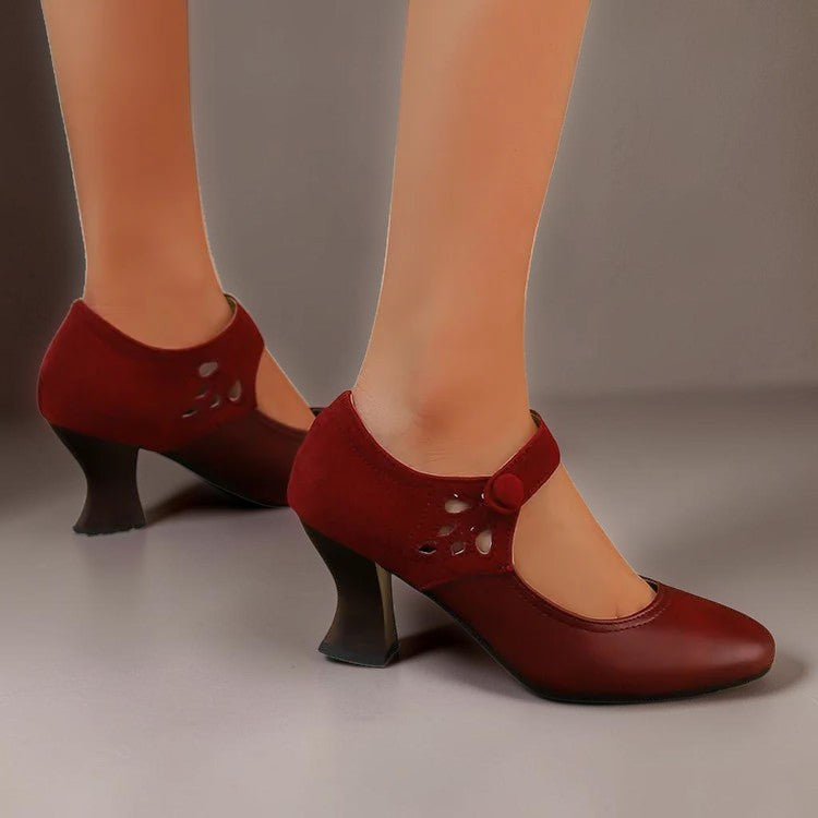 Vivian & Cole Antonia red suede round-toe heels with a stable block heel and secure ankle strap on a model
