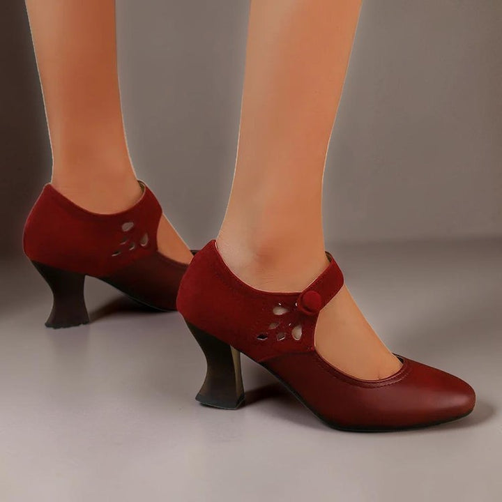 Vivian &amp; Cole Antonia red suede round-toe heels with a stable block heel and secure ankle strap on a model