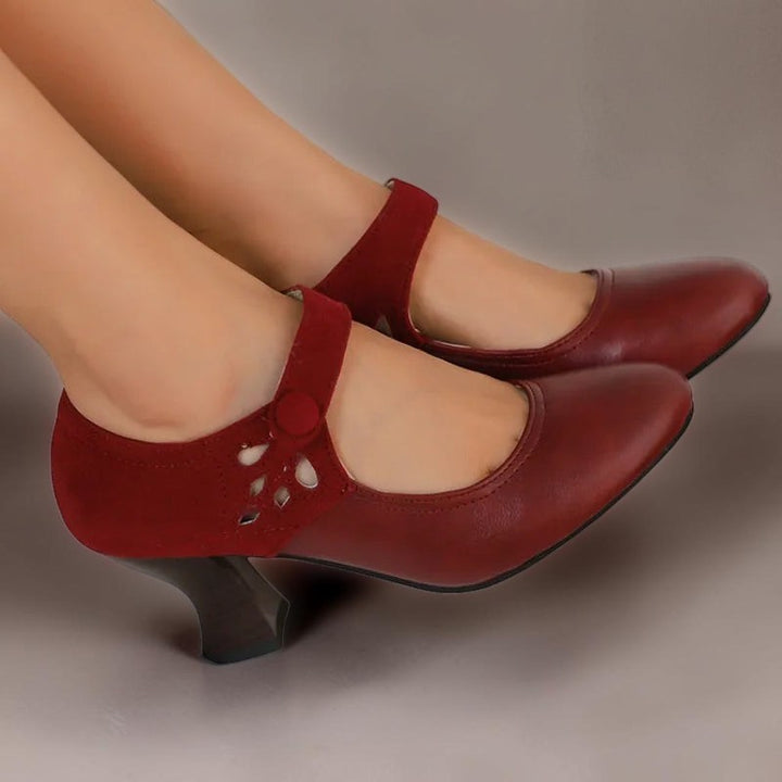Vivian &amp; Cole Antonia red suede round-toe heels with a secure ankle strap and stable block heel on a model