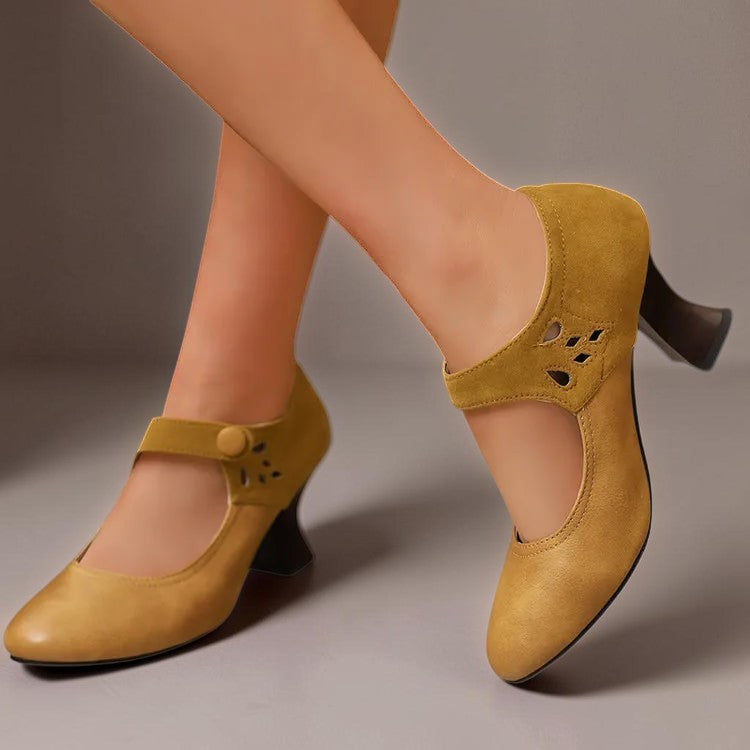 Vivian &amp; Cole Antonia yellow suede round-toe heels with a stable block heel and secure ankle strap on a model