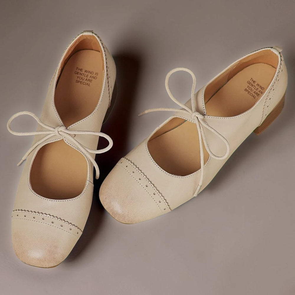 Vivian & Cole beige carved leather oxford shoes with a low block heel and delicate lace-up detail
