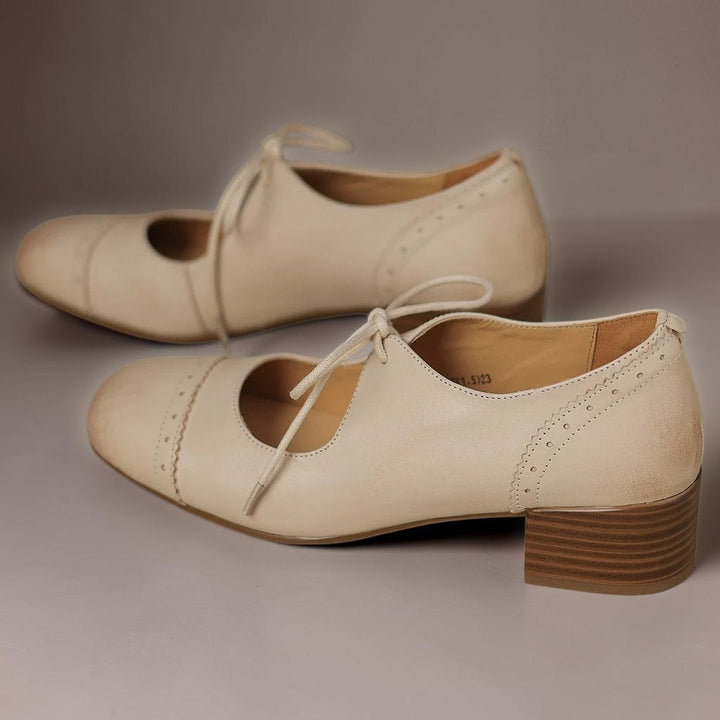 Vivian &amp; Cole beige carved leather oxford shoes with a low block heel and delicate lace-up detailing