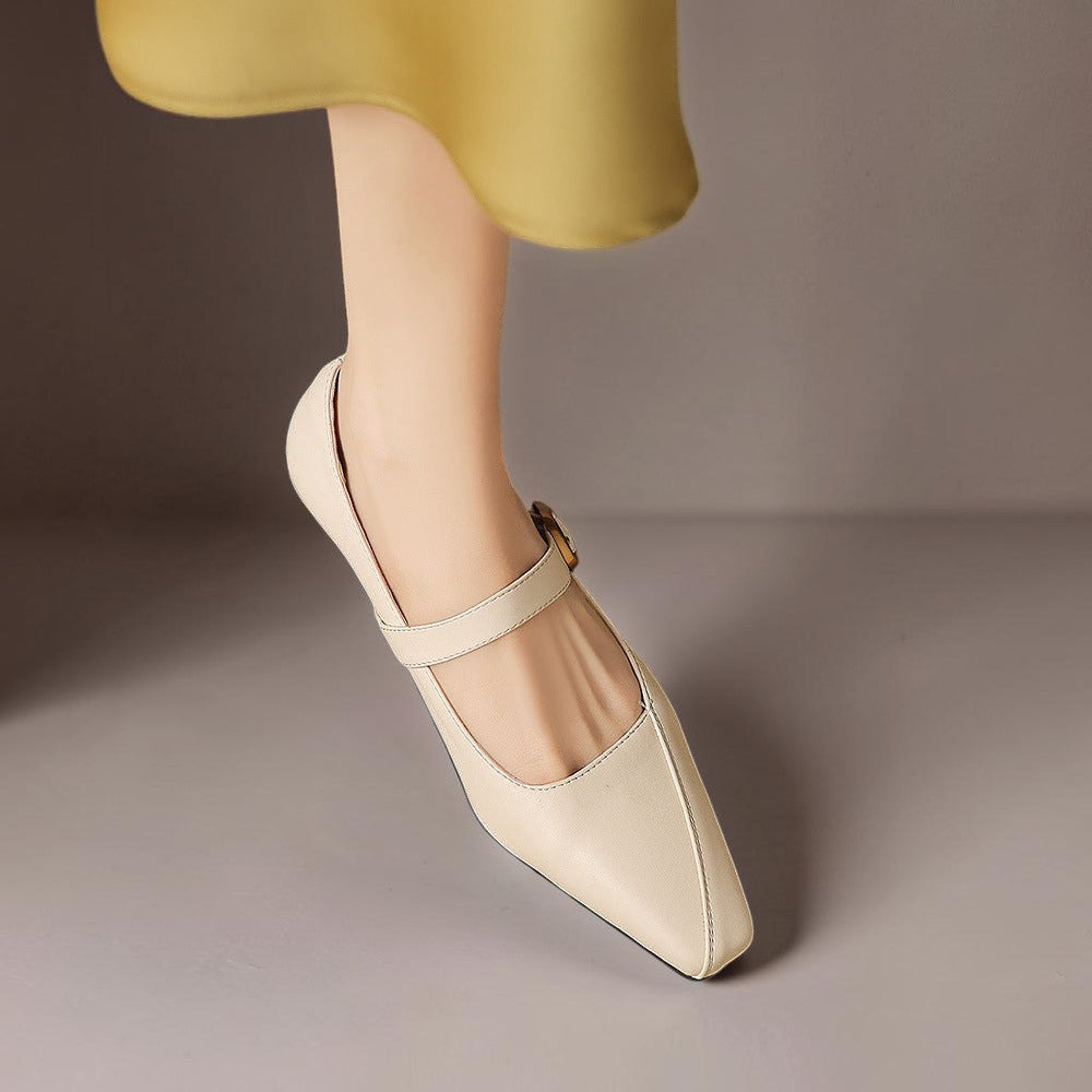 Vivian &amp; Cole beige leather paneled Mary Jane heel with a gold-tone buckle and low block heel on a model