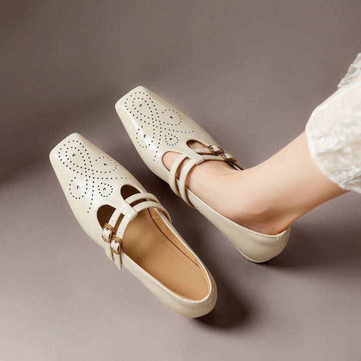 Vivian &amp; Cole Marisol beige leather Mary Jane pumps with brogue detailing, dual buckled straps, and a low block heel.