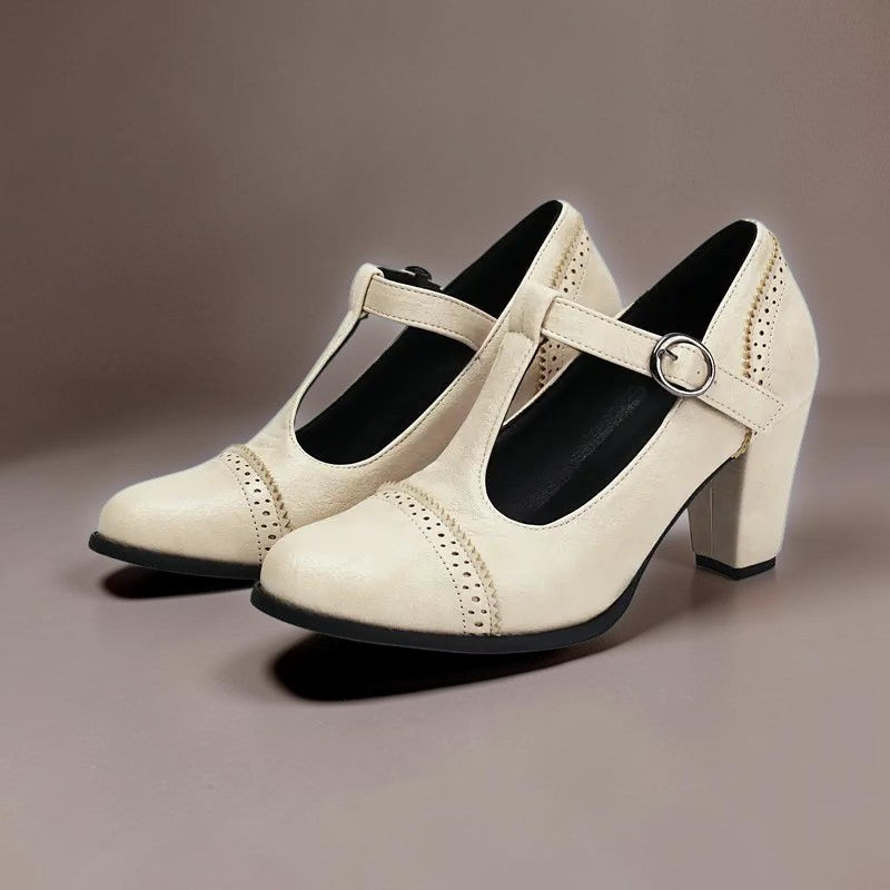 Vivian &amp; Cole Wilhelmina beige T-strap brogue heels with classic punched detailing and a steady block heel.
