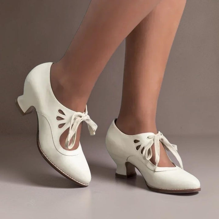 Vivian &amp; Cole beige vintage-style lace-up Mary Jane pumps with a rounded toe and comfortable low block heel