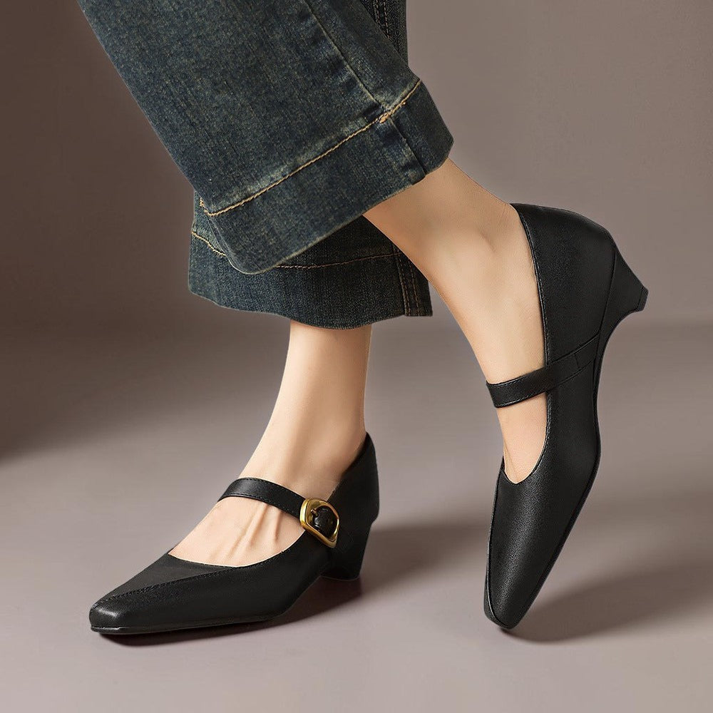 Vivian &amp; Cole black leather paneled Mary Jane heels with a gold-tone buckle and low block heel worn with jeans