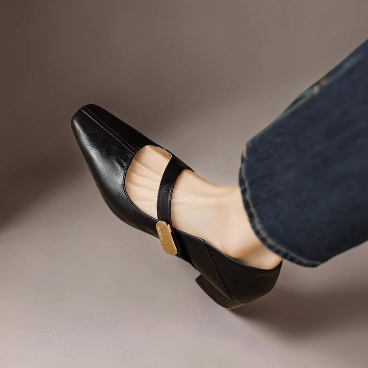 Vivian &amp; Cole black leather Mary Jane pump with a chiseled square toe, gold bit accent, and low block heel