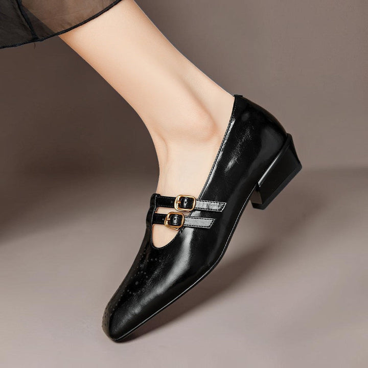 Vivian &amp; Cole Marisol black leather Mary Jane pump with brogue detailing, dual buckled straps, and a low block heel.