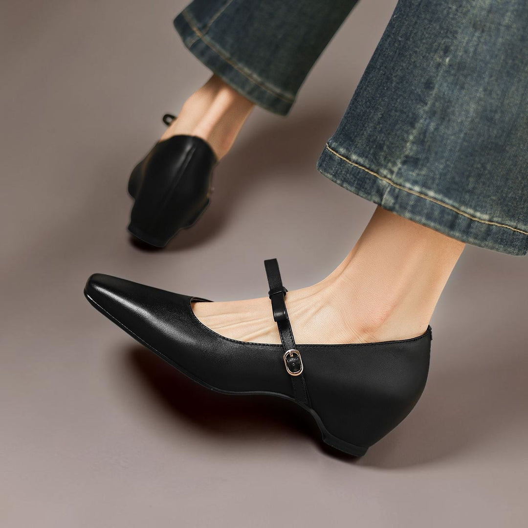 Vivian &amp; Cole black leather Mary Jane pumps with a bow-strap and concealed block heel worn with blue jeans
