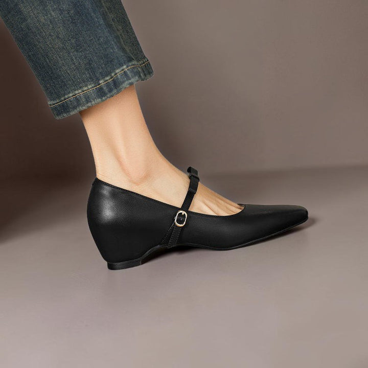 Vivian &amp; Cole black leather Mary Jane pump with a bow-strap and concealed block heel worn with blue jeans
