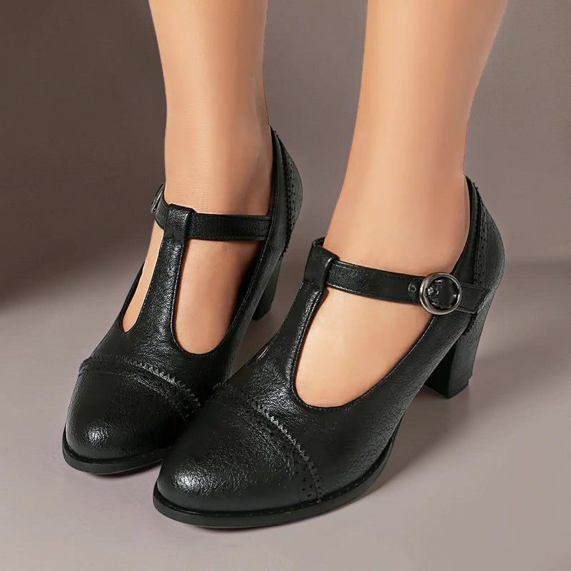 Vivian & Cole Wilhelmina black T-strap brogue heels with a steady block heel and classic punched detailing