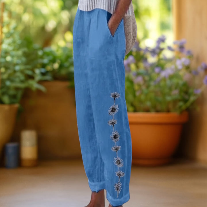 Vivian &amp; Cole blue linen-feel loose trousers with floral embroidery detail and elastic waist.