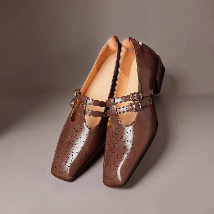Vivian &amp; Cole Marisol brown leather Mary Jane pumps with brogue detailing, dual buckled straps, and a low block heel.
