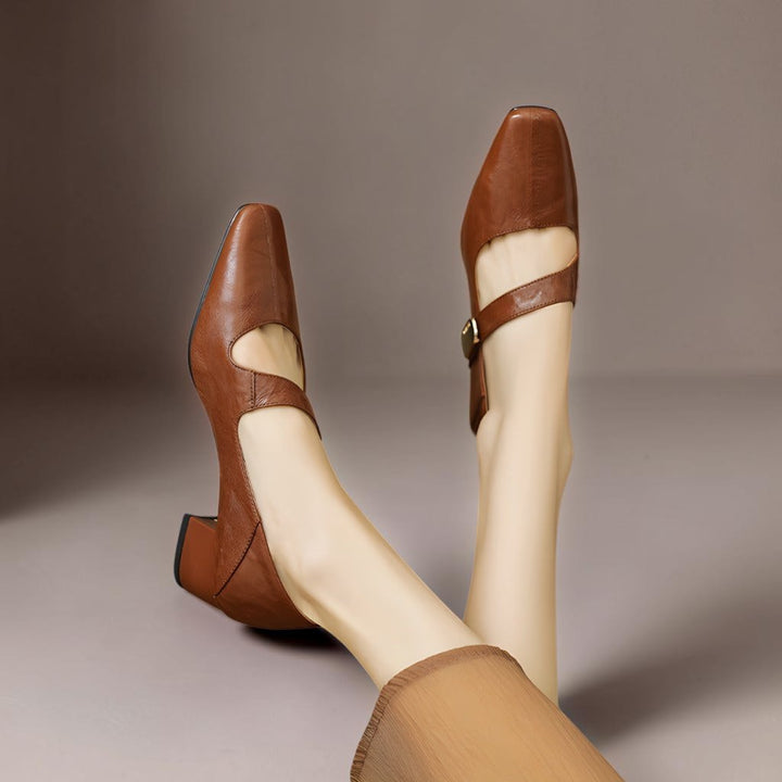 Vivian &amp; Cole Quera brown leather Mary Jane pumps featuring a chiseled square toe, cut-out vamp, and low block heel.