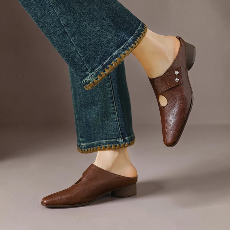 Vivian & Cole Olga brown genuine leather mules with side strap detail and block heel worn with cropped jeans