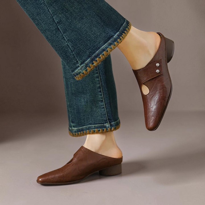 Vivian &amp; Cole Olga brown genuine leather mules with side strap detail and block heel worn with cropped jeans