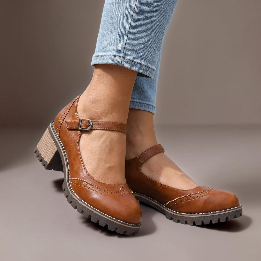 Vivian &amp; Cole Marie brown leather T-strap Mary Jane heels with a chunky lug sole and buckle closure on a model
