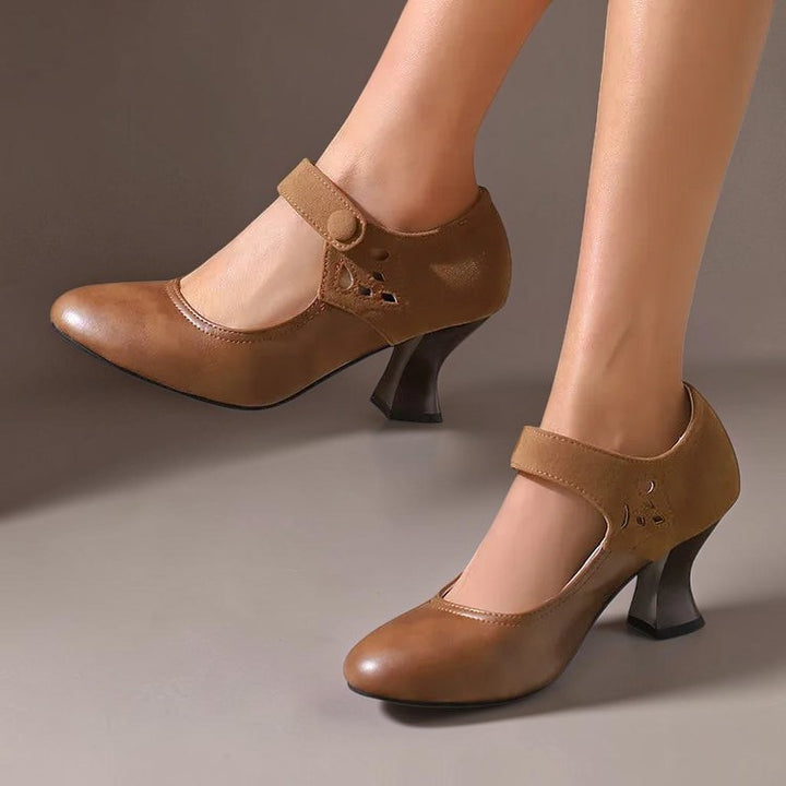 Vivian &amp; Cole Antonia brown suede round-toe heels with a stable flared heel and secure ankle strap on a model