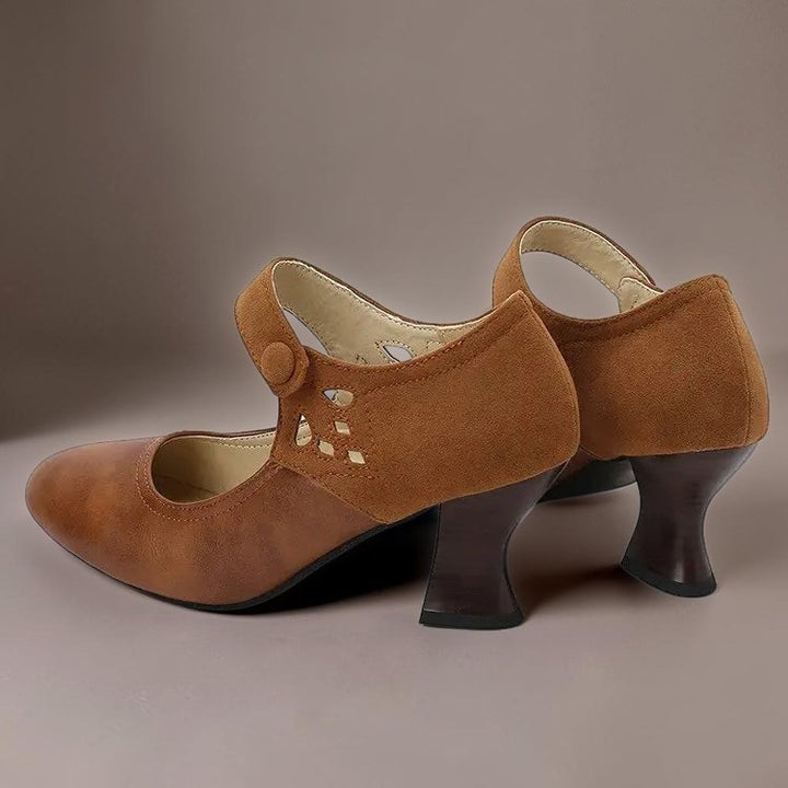 Vivian &amp; Cole Guinevere brown Victorian button strap heels with a stable flared heel and cutout side detail