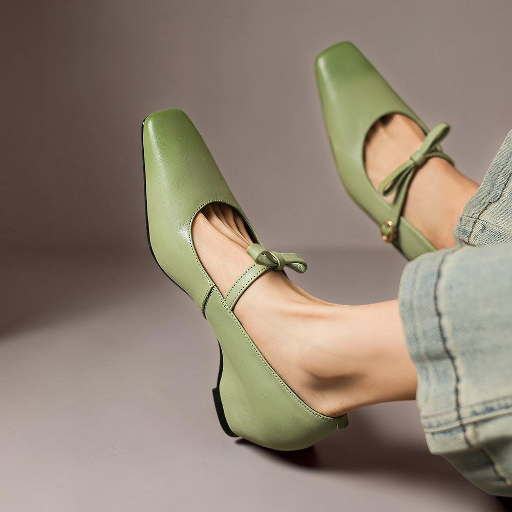 Vivian &amp; Cole Bryony green leather Mary Jane pumps with a bow-strap and concealed block heel worn with jeans