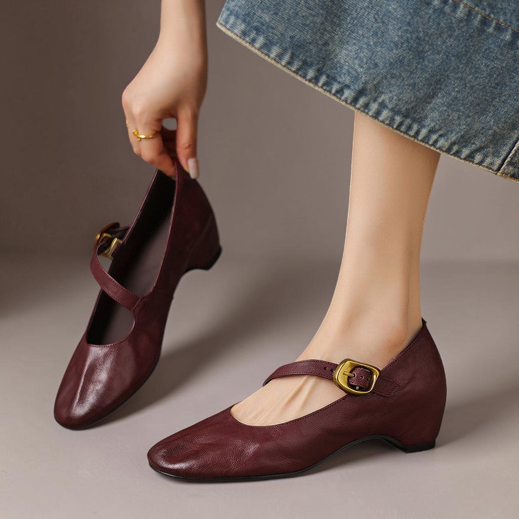 Vivian & Cole burgundy leather Mary Jane flats with a round toe, gold-tone buckle strap, and low block heel.