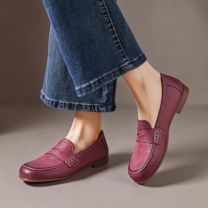 Vivian &amp; Cole Galea burgundy genuine leather penny loafers with moc-toe stitching worn with blue denim jeans