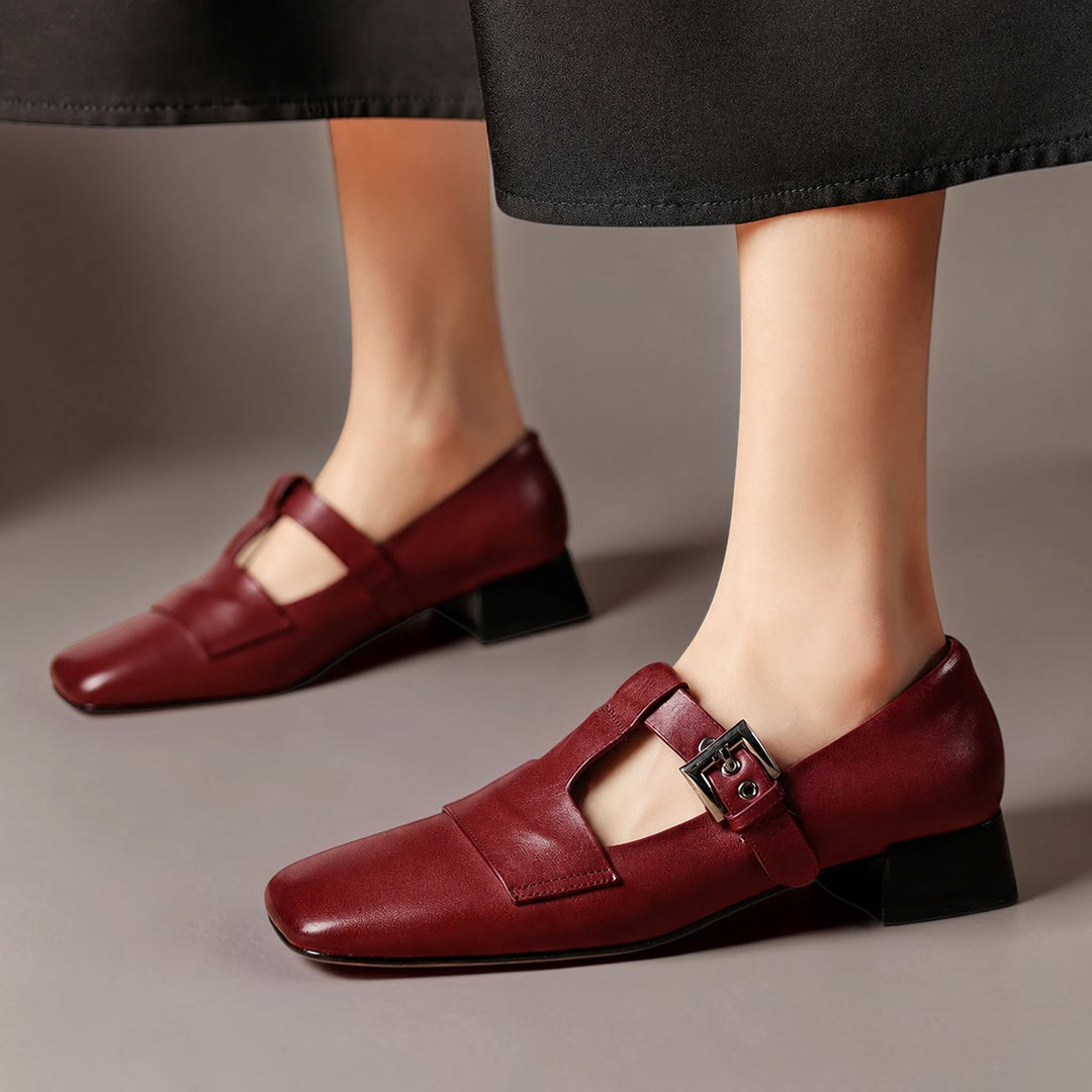 Vivian & Cole Veyra burgundy genuine leather T-strap pumps with a square toe and stable block heel on a model