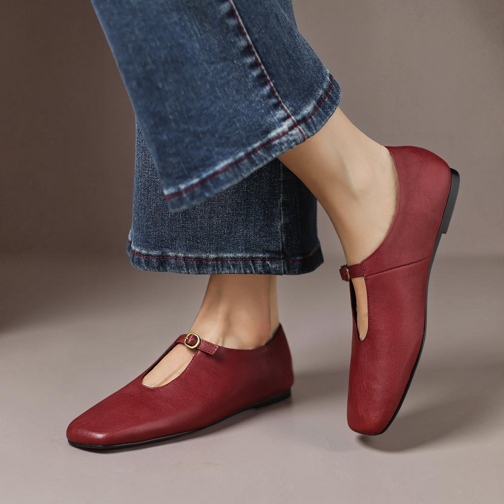 Vivian &amp; Cole Elspeth claret red leather high-vamp Mary Jane flats with a slim instep strap and metallic buckle.