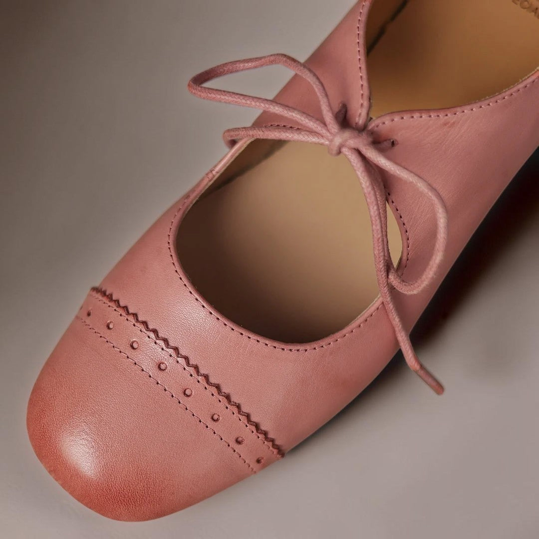 Vivian &amp; Cole Constance pink leather oxford shoe with delicate carved detailing and a soft lace-up front closure.