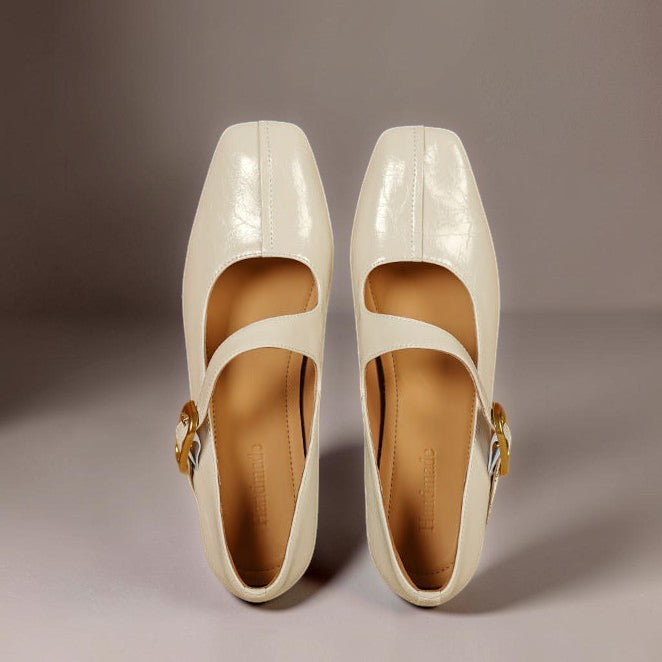 Vivian &amp; Cole Viora cream genuine leather Mary Jane heels with a square toe, tilted buckle strap, and cushioned sole.