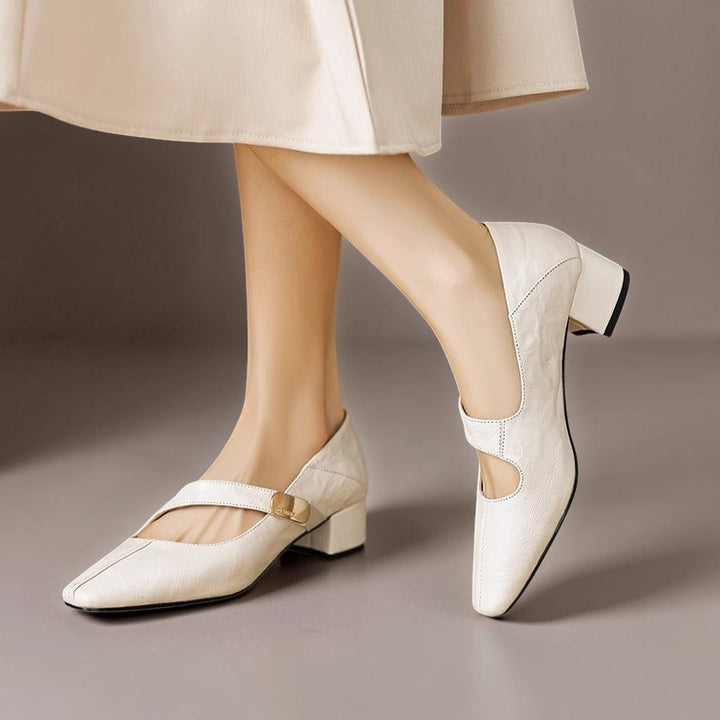 Vivian &amp; Cole cream leather Mary Jane pumps with a chiseled square toe, gold bit accent, and low block heel