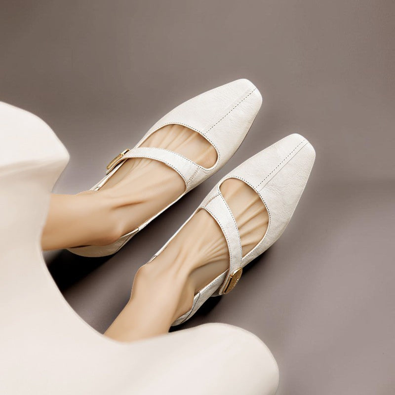 Vivian &amp; Cole Quera cream leather Mary Jane pumps with a chiseled square toe, cut-out vamp, and gold hardware detail.