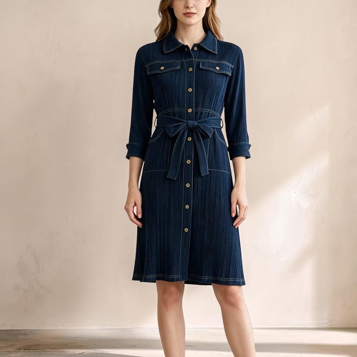 Vivian &amp; Cole Delphine deep blue denim-look midi dress with a collared bodice, button front, and waist tie belt.