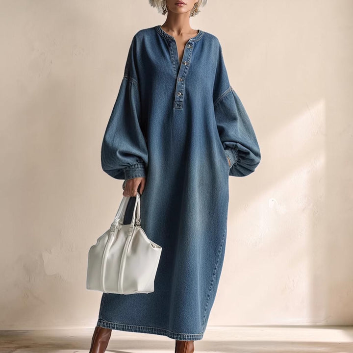Vivian &amp; Cole denim maxi dress with balloon sleeves, button-up neckline, and relaxed fit, styled with a white handbag.