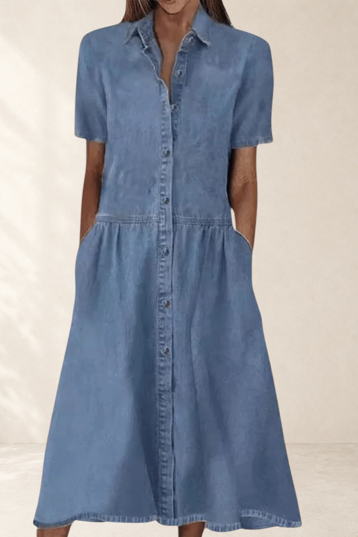 Vivian &amp; Cole Aada™ light wash denim midi dress with short sleeves, collared neckline, button-down front, and side pockets.