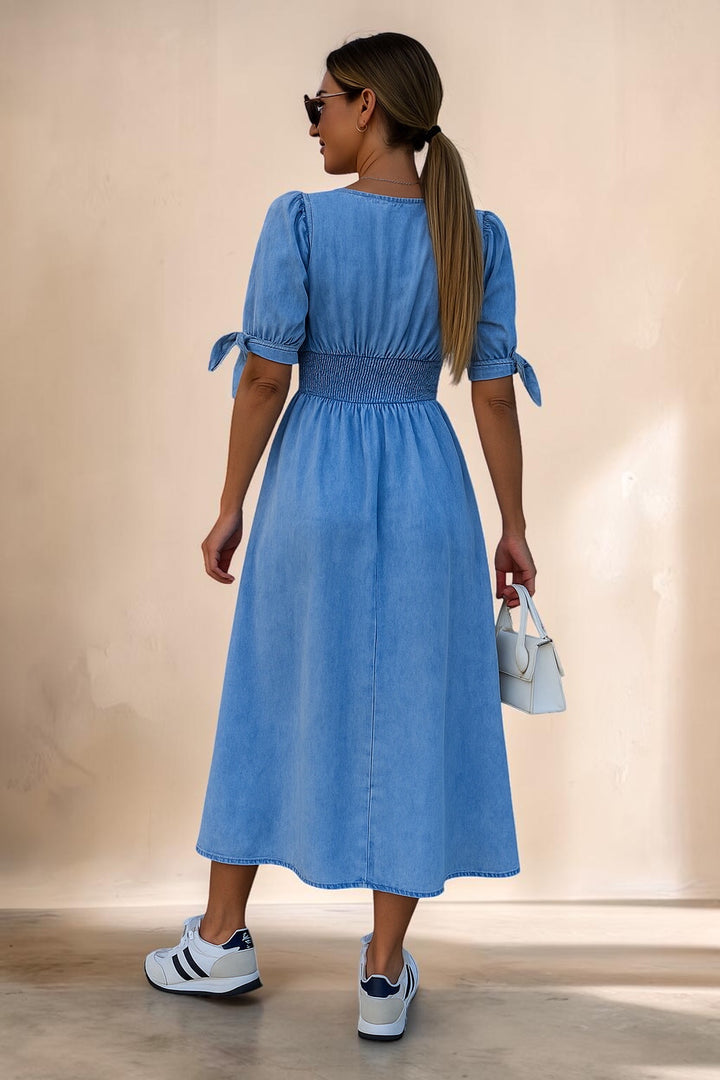 Vivian &amp; Cole Jacqueline denim midi dress with smocked waist, puff sleeves, and tie details worn with sneakers