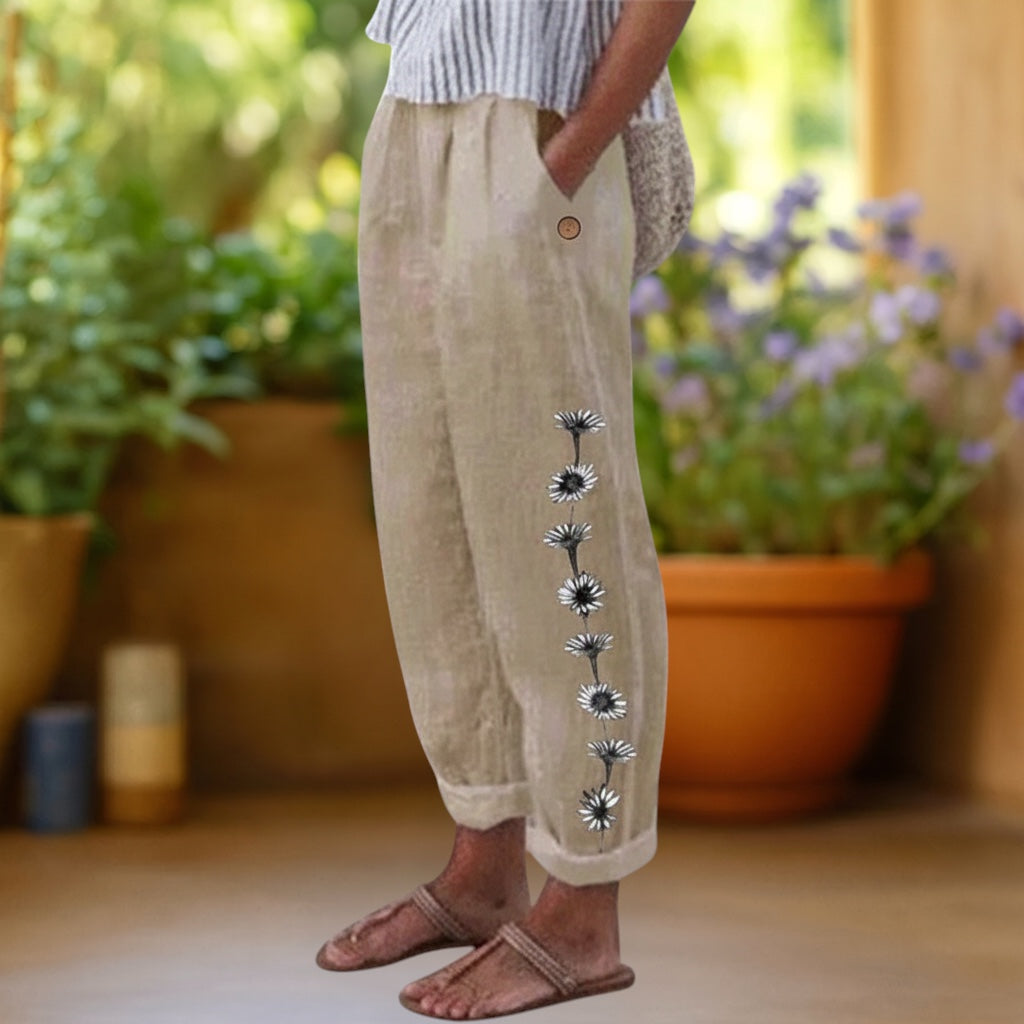 Vivian &amp; Cole Flora floral print loose beige linen-feel trousers with elastic waist and pockets.
