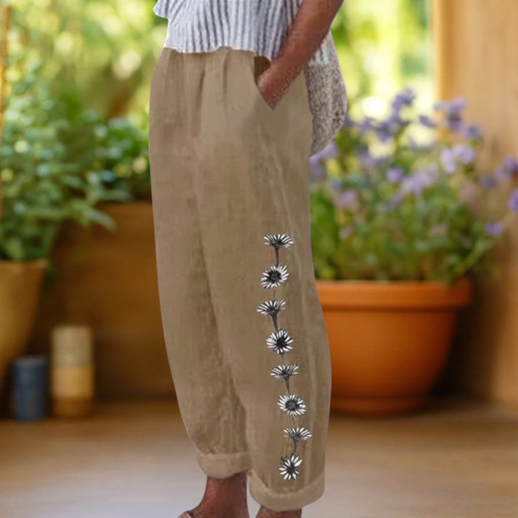 Vivian &amp; Cole Flora floral print loose trousers in tan with elastic waist and pockets. Linen-feel blend.