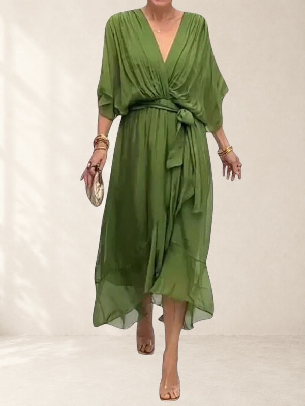 Vivian &amp; Cole green V-neck wrap dress with tie waist and flowing skirt, ideal for special occasions.