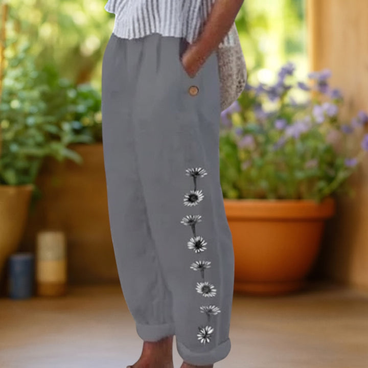 Vivian &amp; Cole grey linen-feel loose trousers with a side floral print and elastic waist.