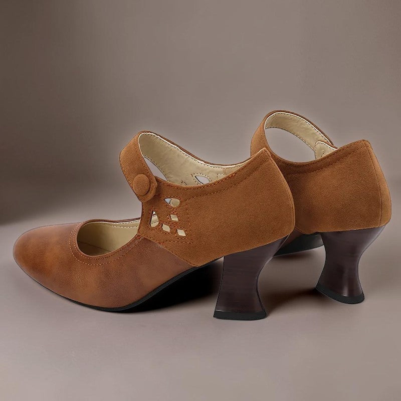 Vivian &amp; Cole Guinevere brown Victorian button strap heels with a stable flared heel and cushioned footbed.