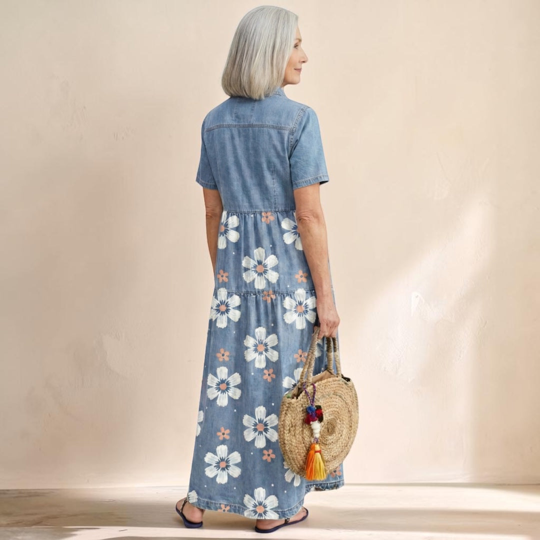 Vivian &amp; Cole Kirra denim midi dress with floral print, short sleeves, and button-front detail on a mature model.